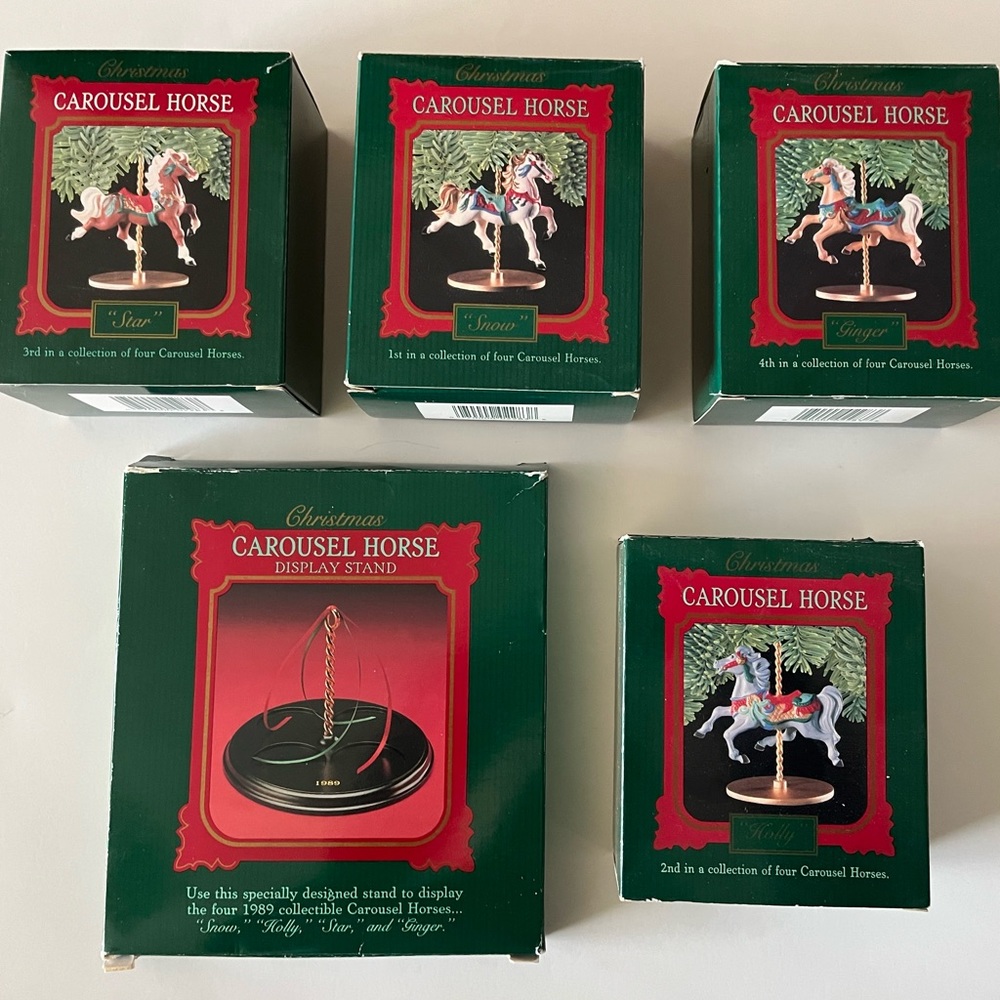 Hallmark 1989 carousel stand and 4 horse set.